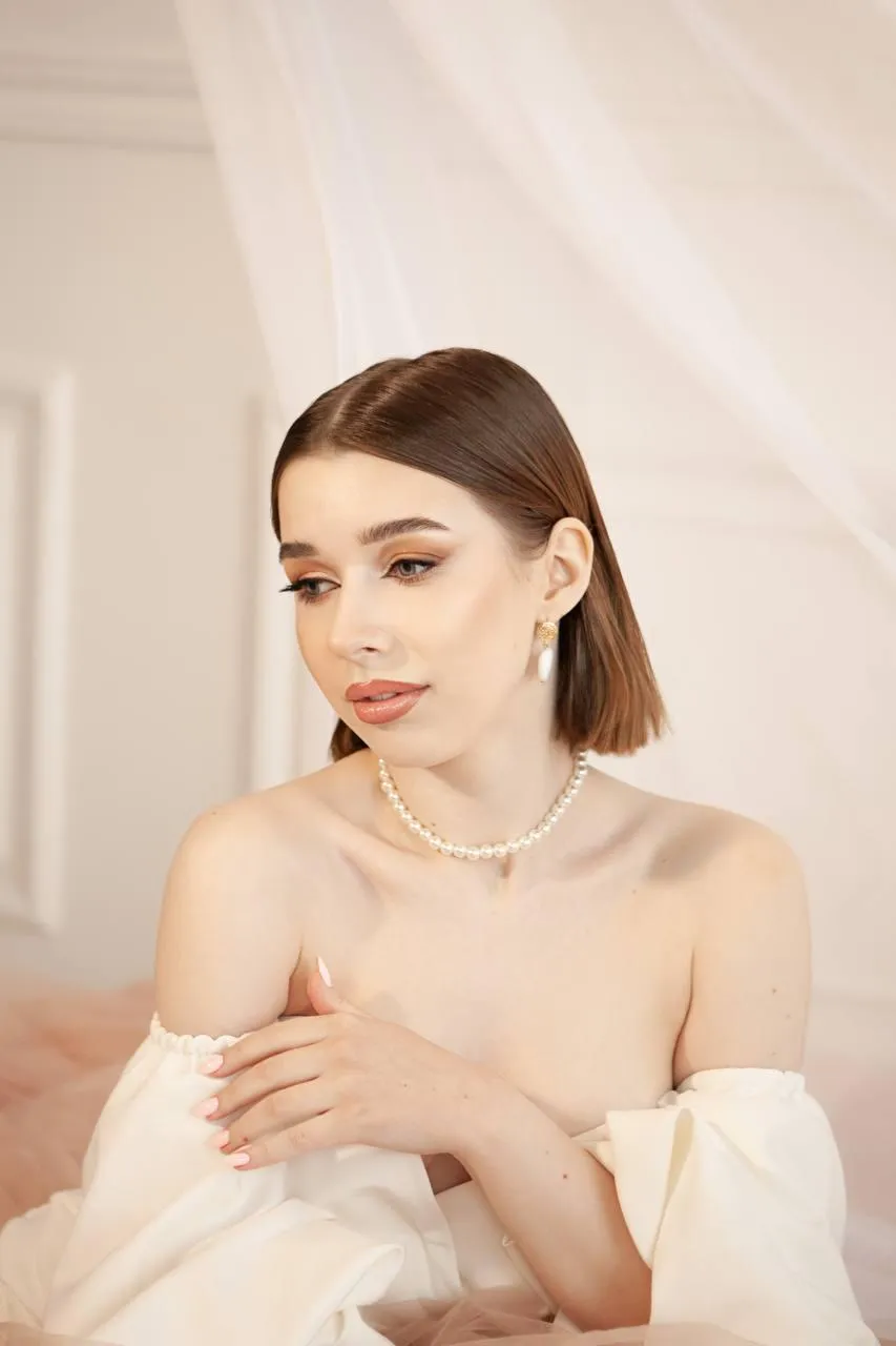 Beautiful woman with short hair sitting in a calm pose image