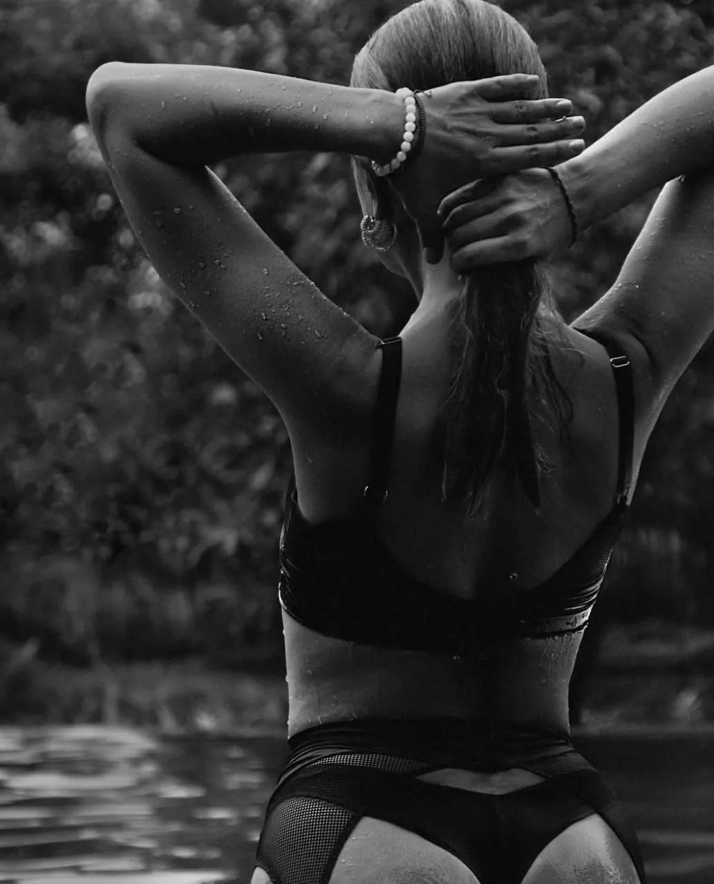 Black And White Back View of a Fit Woman with Arms Crossed