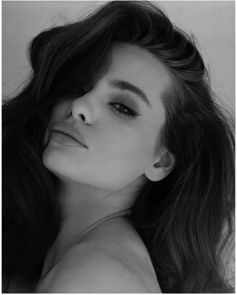 Black and white close up of a woman with voluminous hair