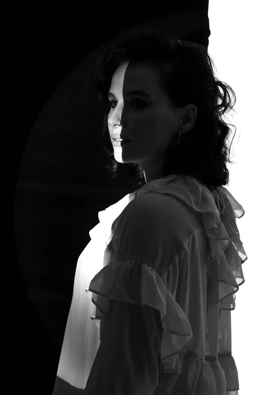 Black and white image of a woman in a studio setting image