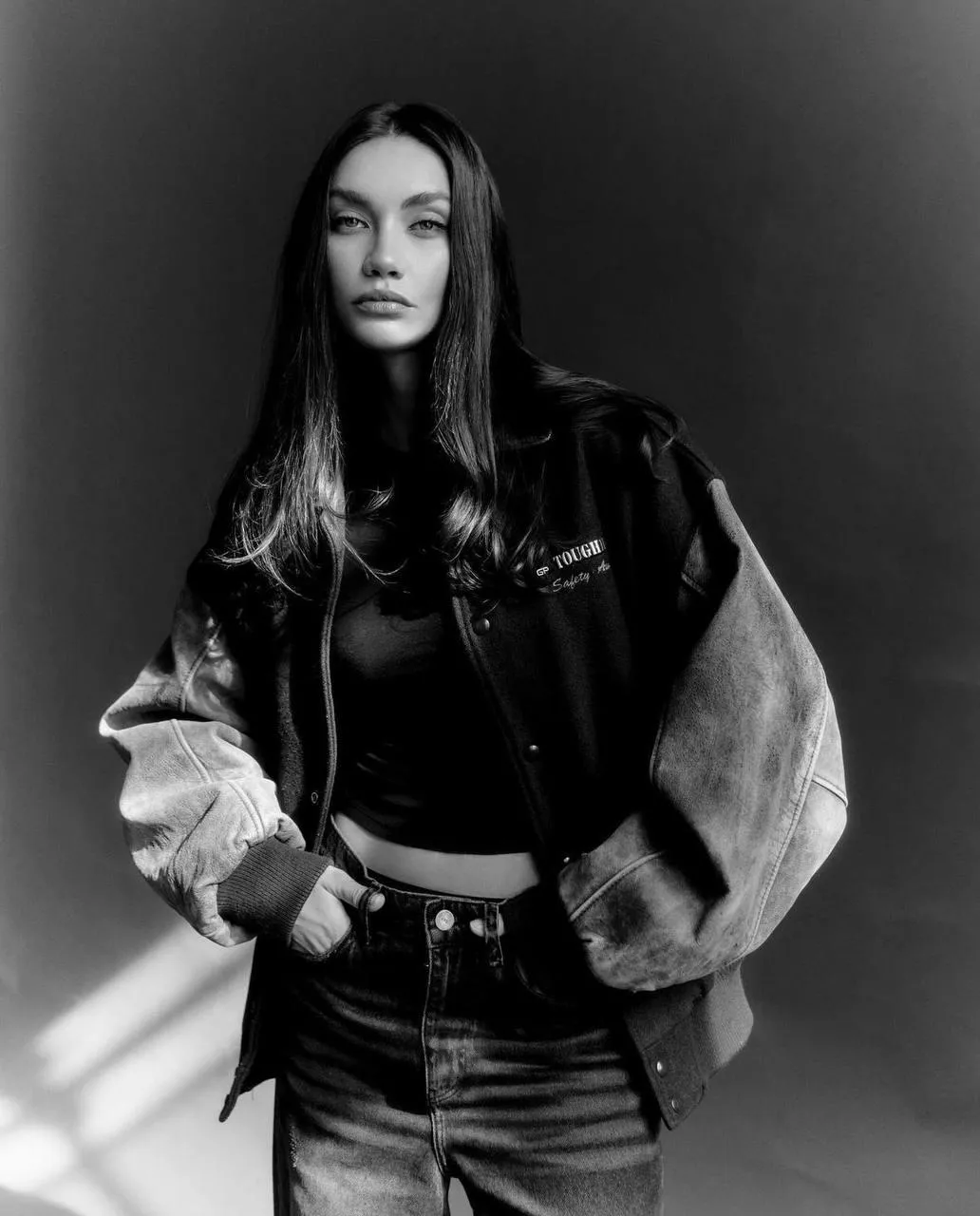 Black And White Photo of a Woman in a Leather Jacket Outfit