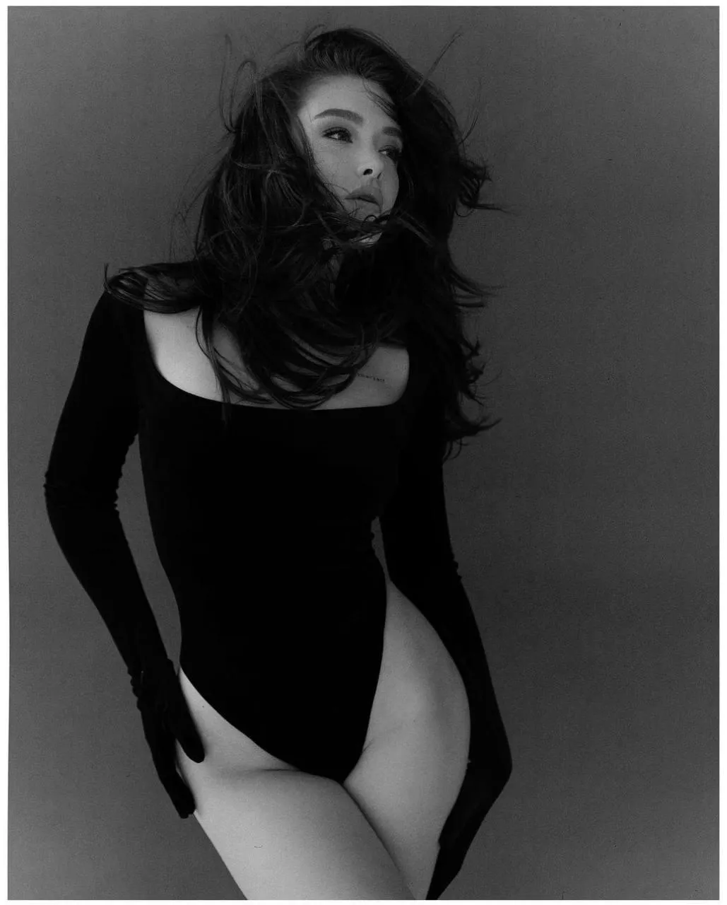 Black And White Portrait of a Woman in a Black Bodysuit