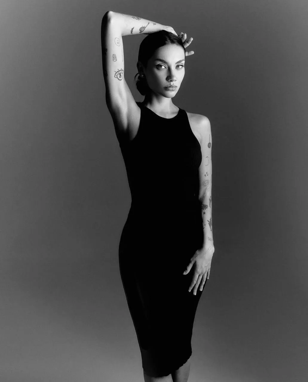 Black and white portrait of a woman in a sleeveless dress