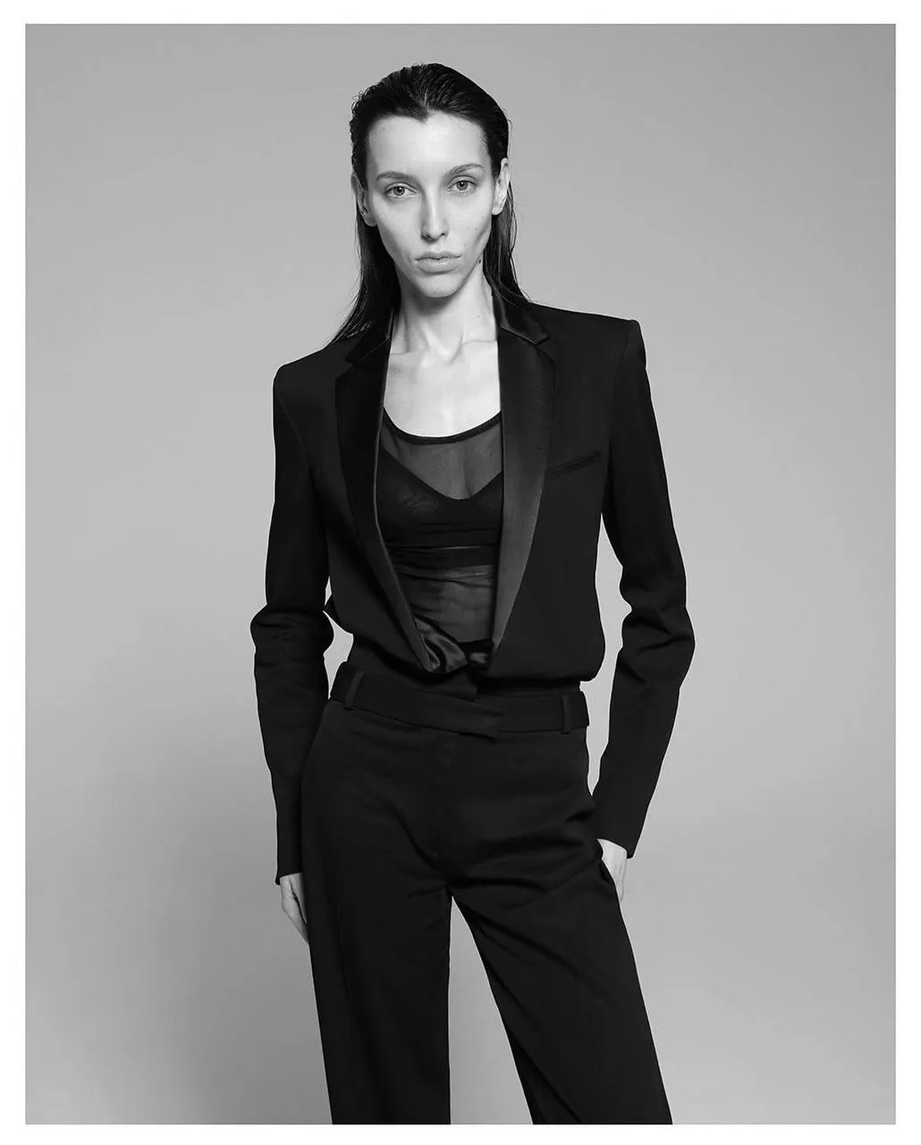 Black and white portrait of a woman in a tailored suit image