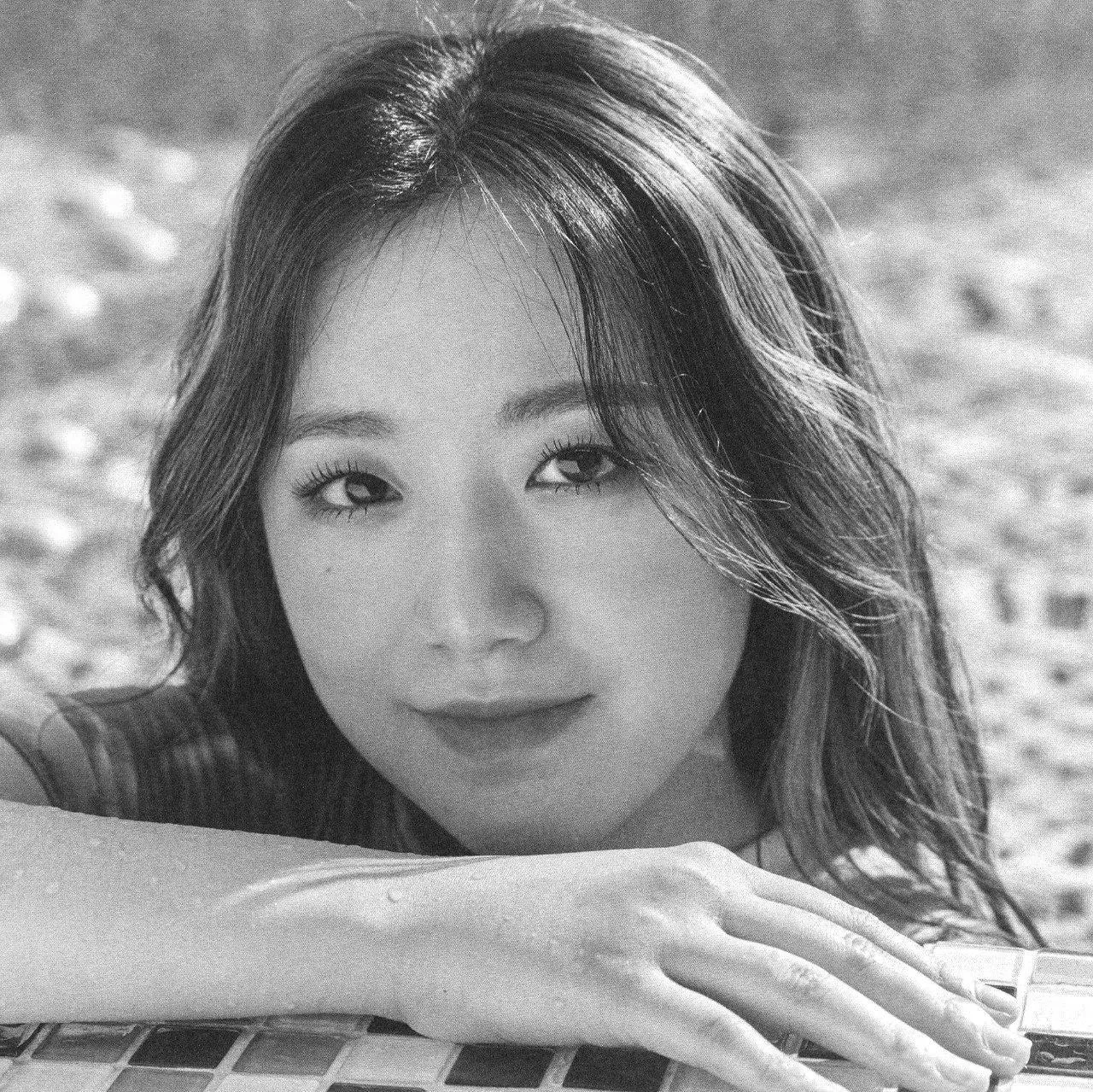 Black And White Portrait of a Woman Resting on a Pillow