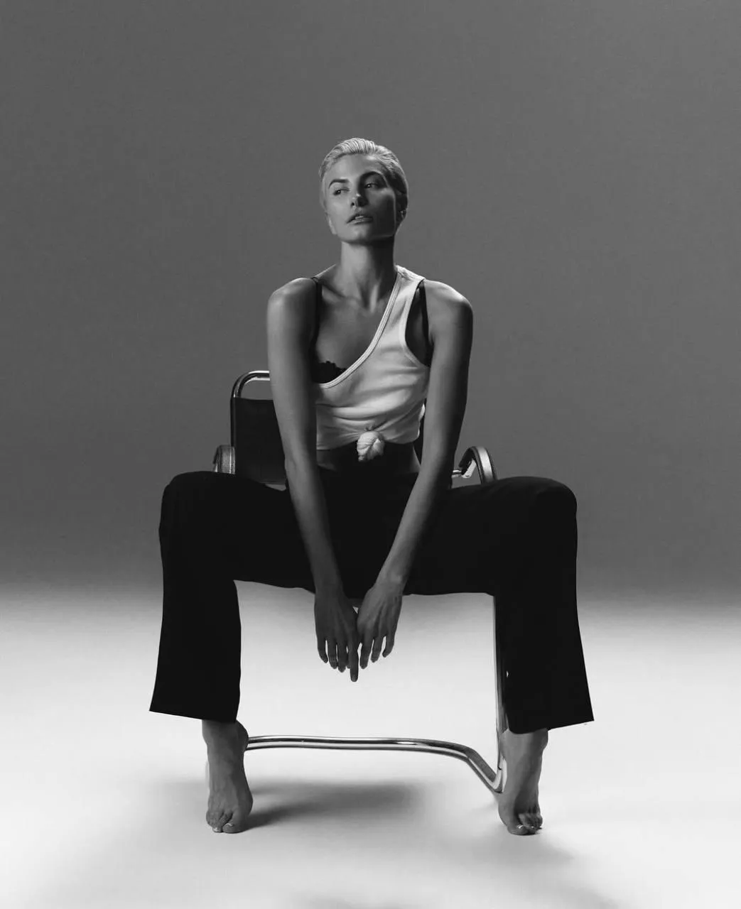 Black and white portrait of a woman sitting on a chair image
