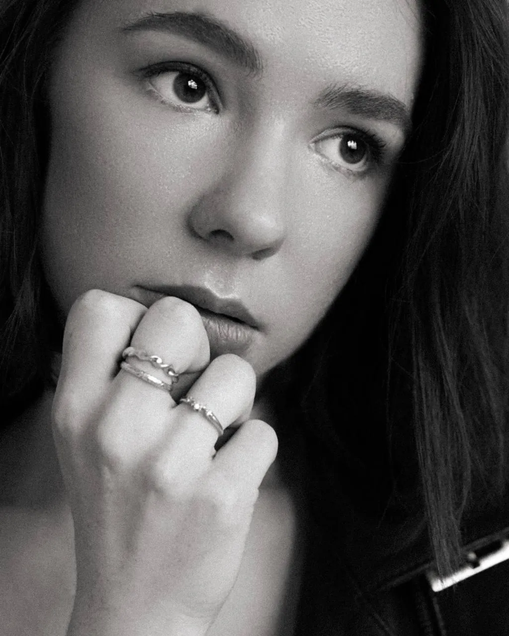 Black And White Portrait of a Woman Touching Her Face Gently