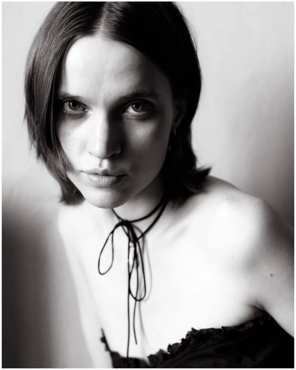 Black and white portrait of a woman with a bold stare image