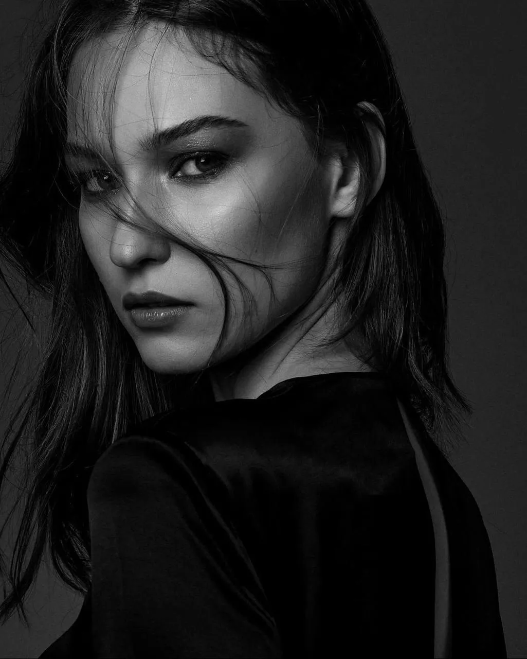 Black And White Portrait of a Woman with a Mysterious Look