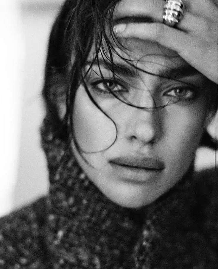 Black and white portrait of a woman with wet slicked hair