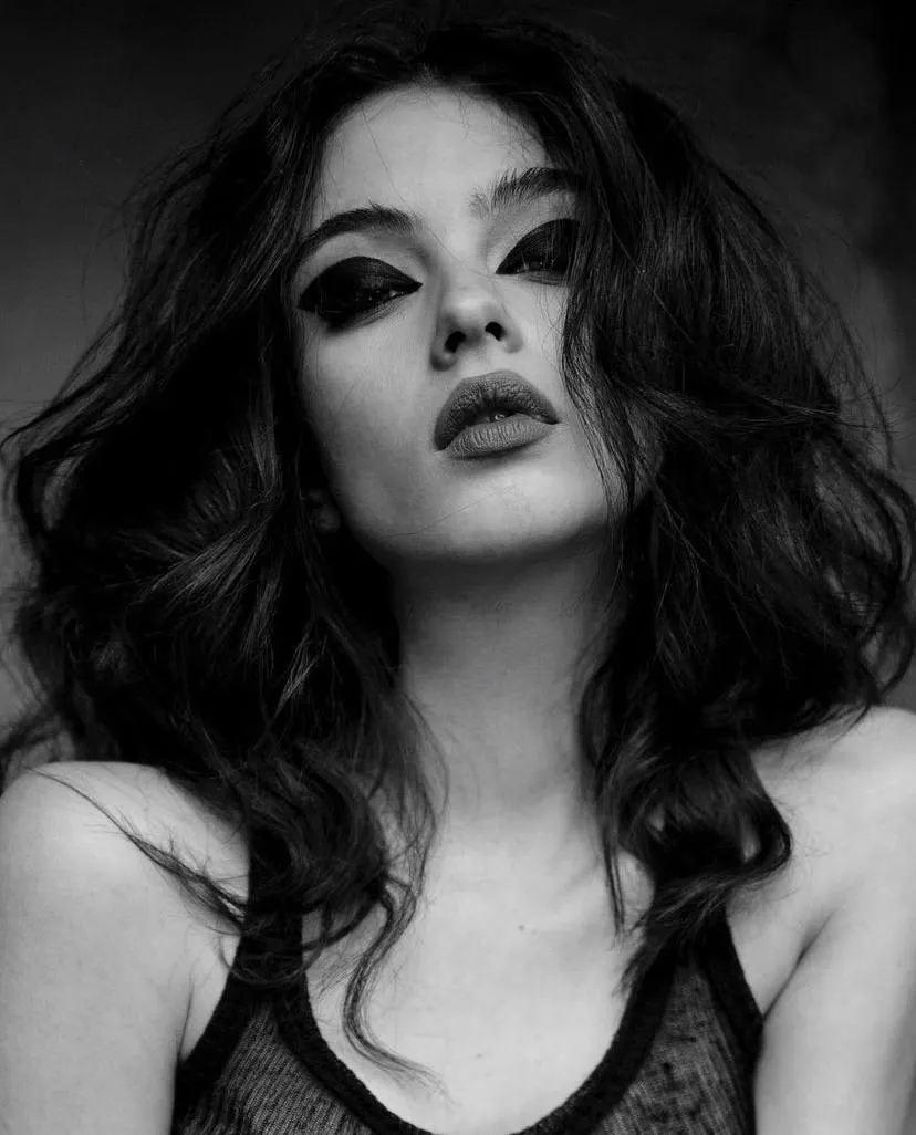 Black and white portrait of woman with voluminous dark hair