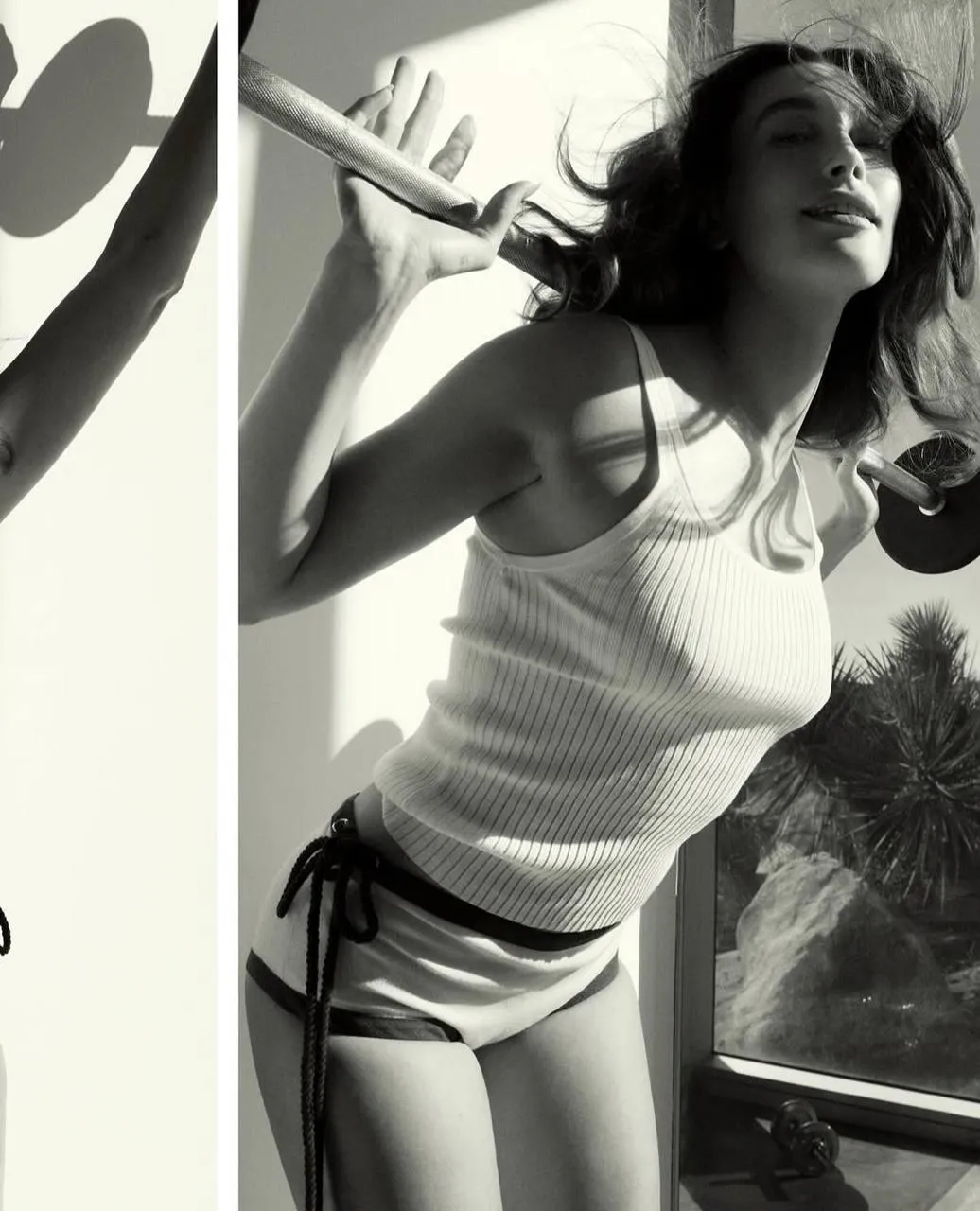 Black And White Shot of a Woman Stretching in a White Top