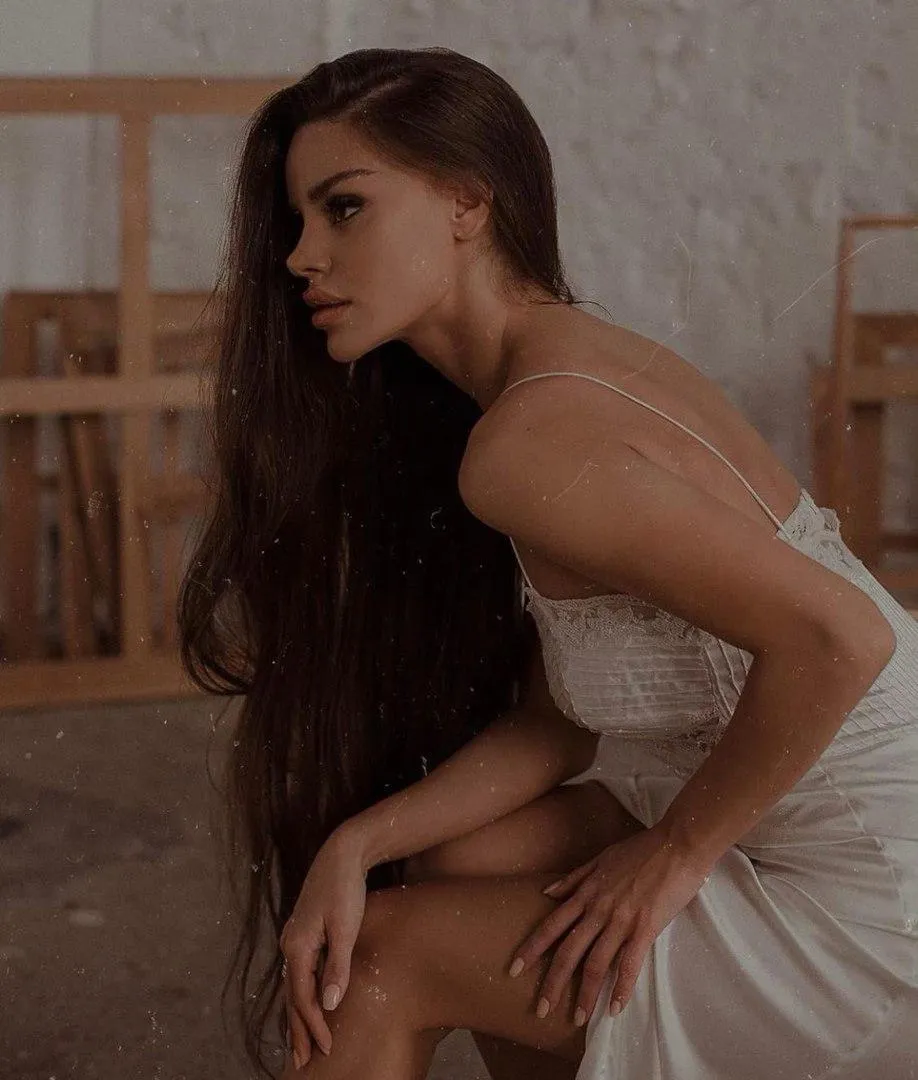 Brunette Model Sitting in Lingerie on a Wooden Stairwell