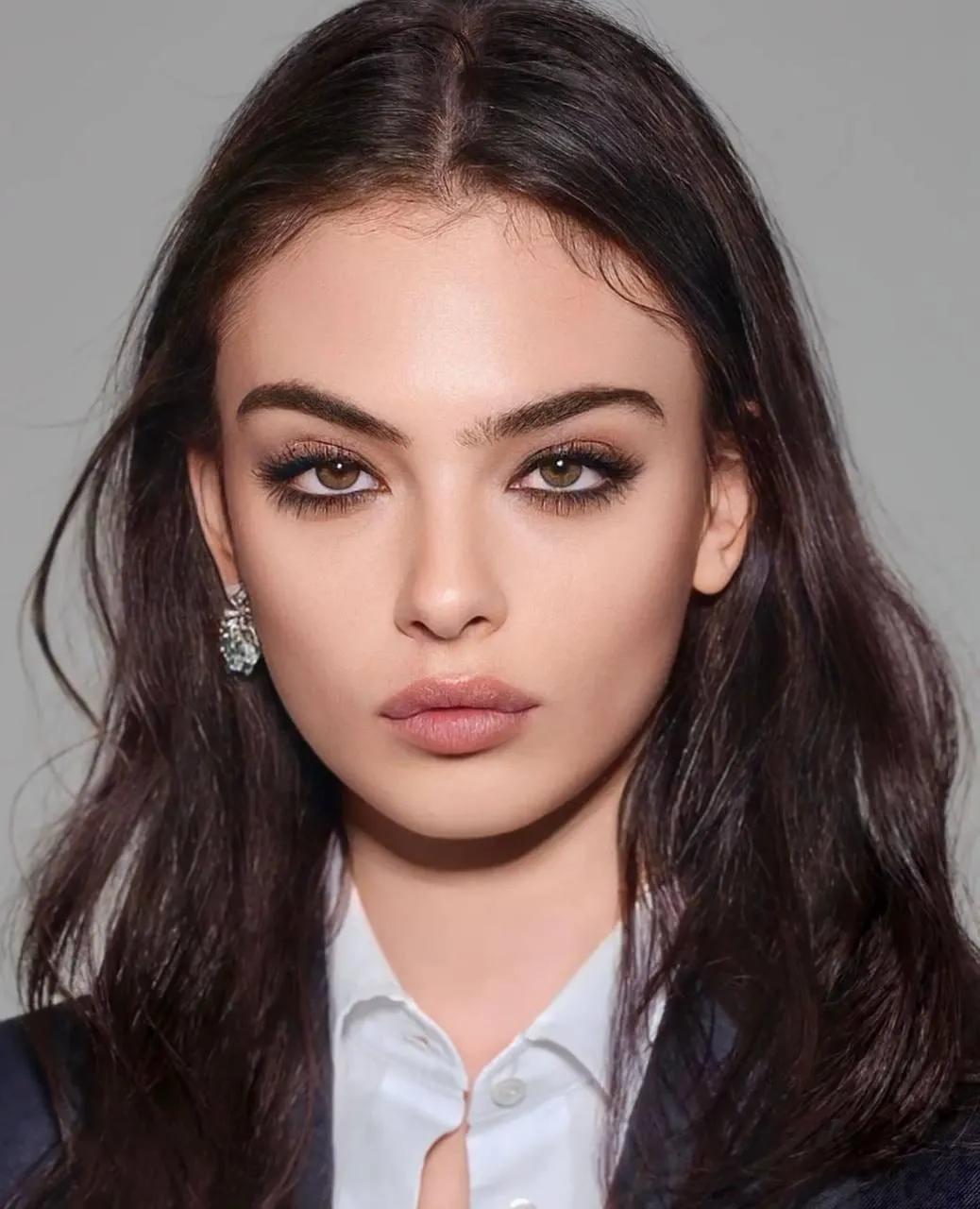 Brunette Woman in a Formal Outfit with Natural Makeup Looks