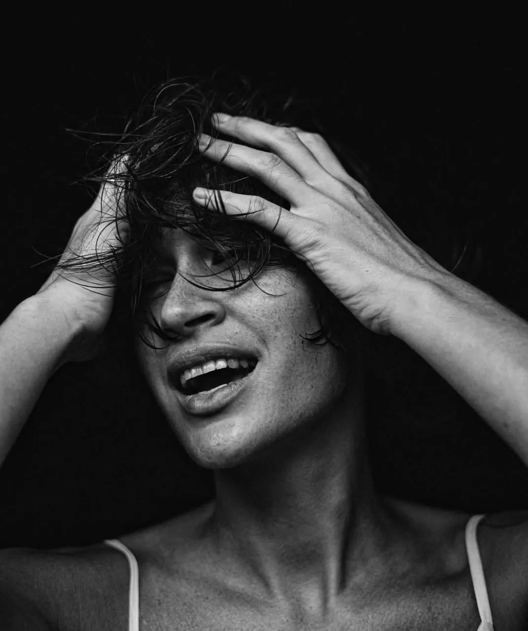 Candid Black And White Portrait with Playful Hair Movement