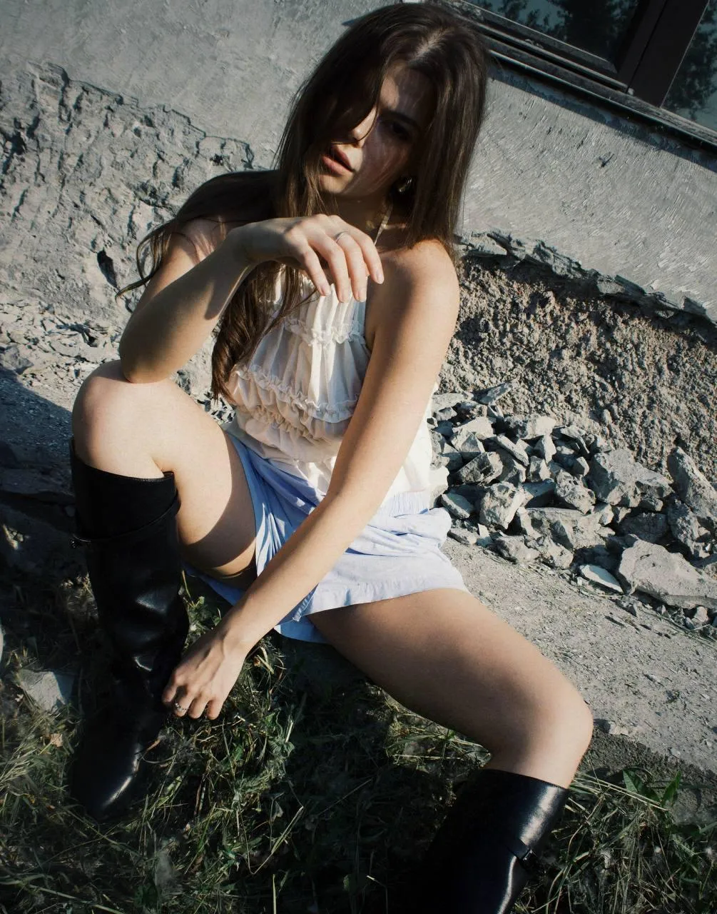 Casual Outdoor Shoot with a Model Sitting on Rocky Ground