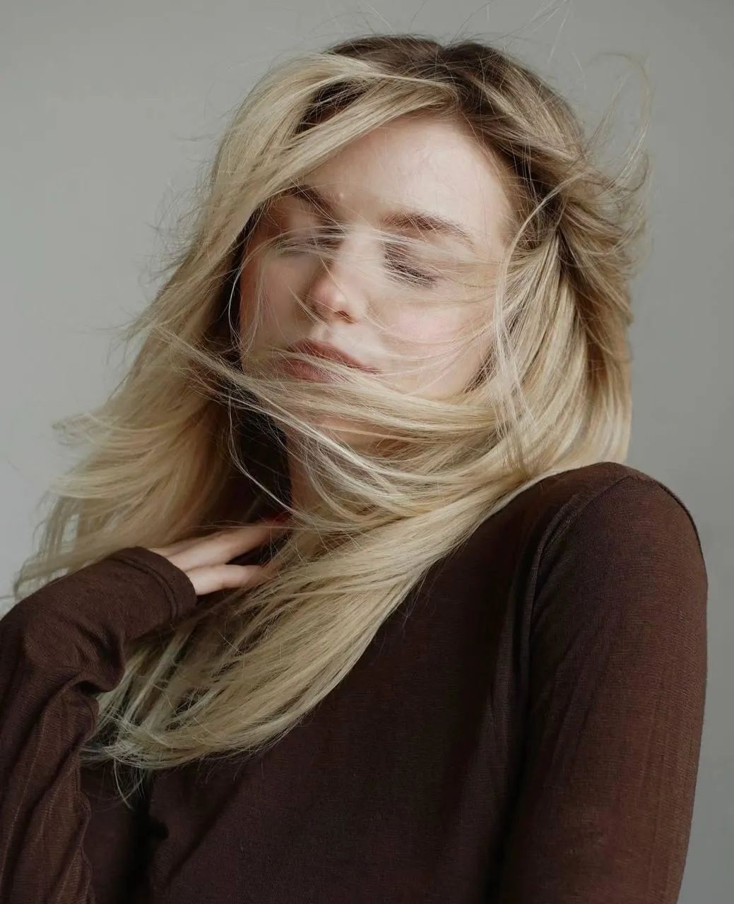 Casual Portrait with Flowing Hair And Warm Neutral Tones