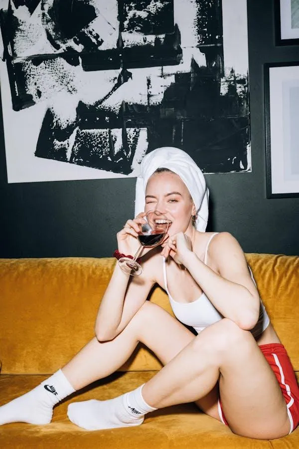 Casual woman sitting on floor wearing a towel and head wrap