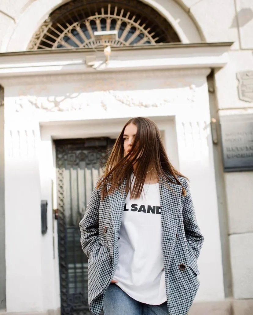 Casual Woman Walking a City Street Wearing Oversized Blazer