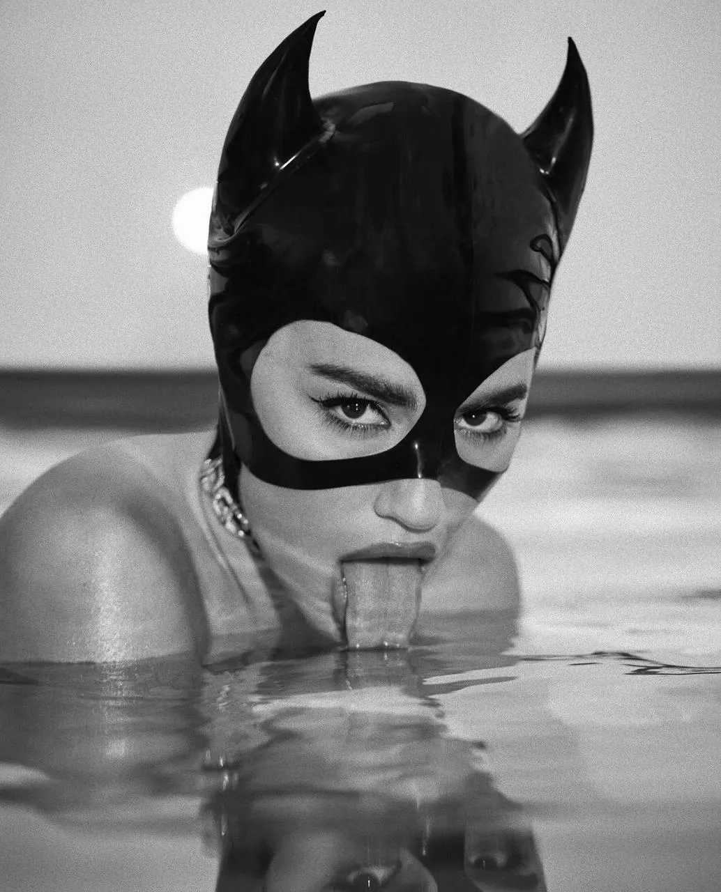 Cat Mask Woman Emerging From Water in a Dramatic Style Image