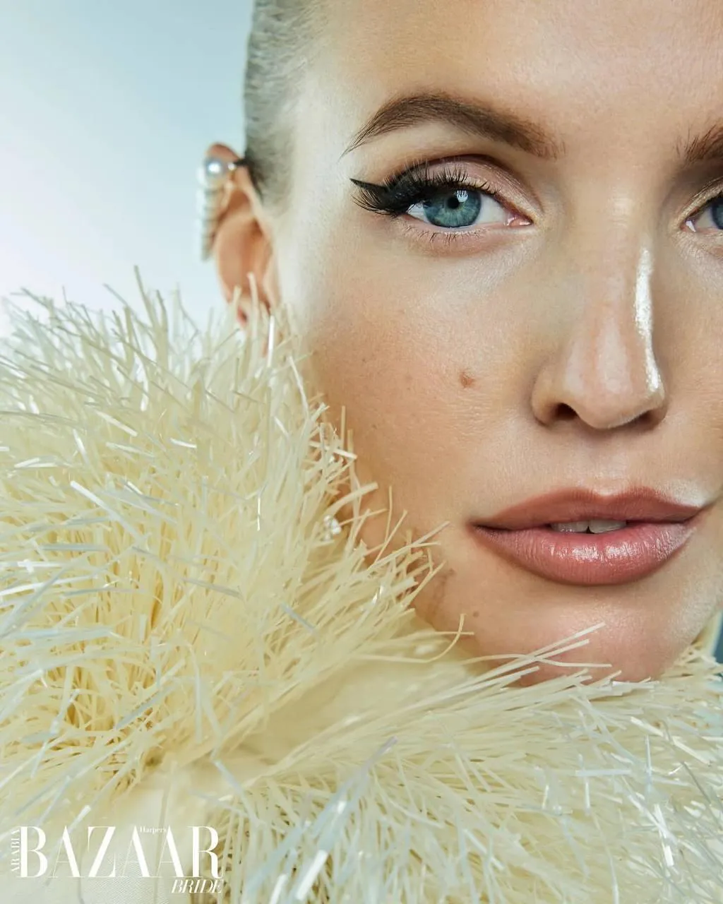 Close Up Beauty Shot of a Woman with Feather Textured Outfit