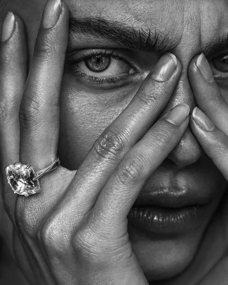 Close Up Image of a Woman with a Ring Covering Half Her Face