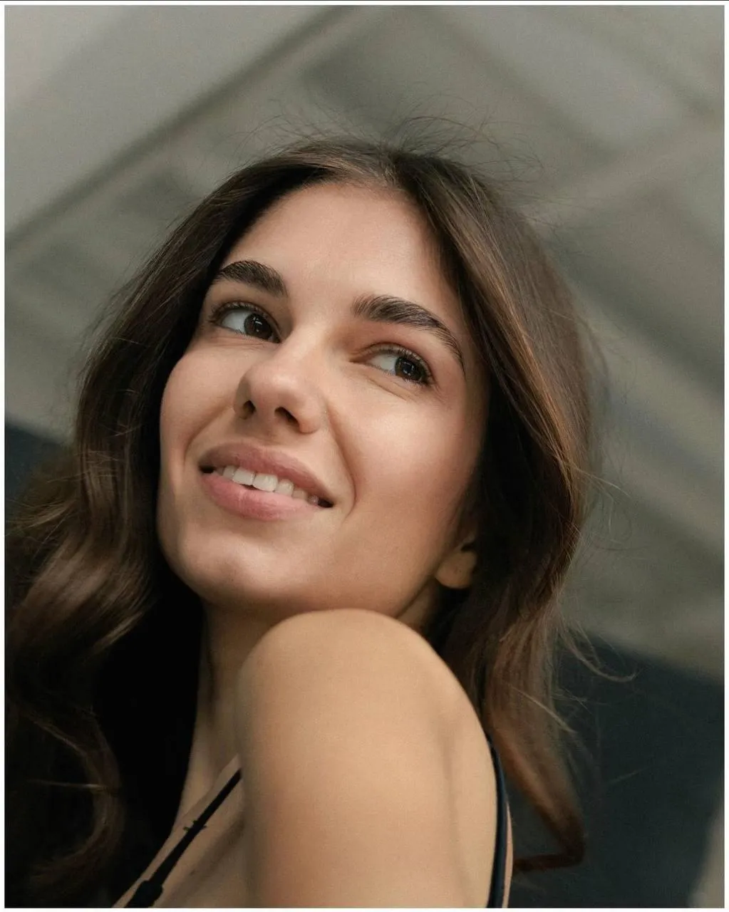 Close Up of a Smiling Woman with Long Dark Brown Hair Image