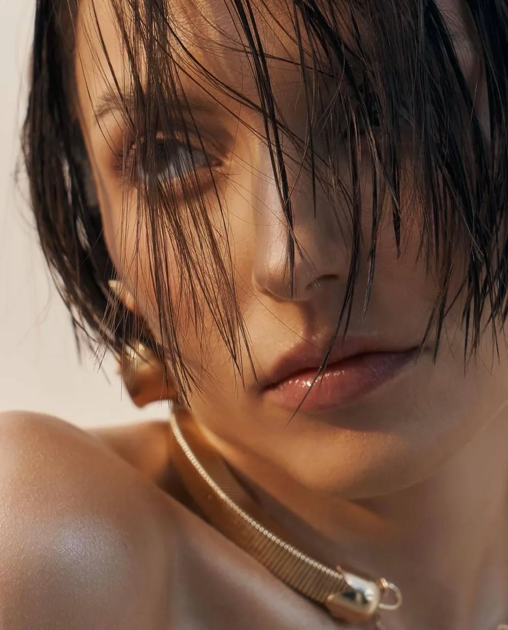 Close Up of a Wet Woman with a Serious Expression And Pearls