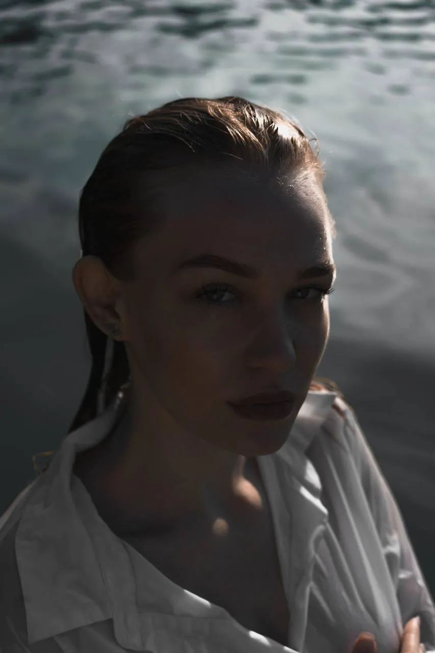 Close up of a woman in a wet dress near the water wallpaper