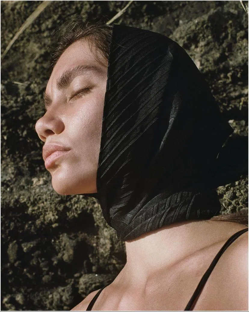 Close Up of a Woman Inthe Sun with a Sheer Black Scarf
