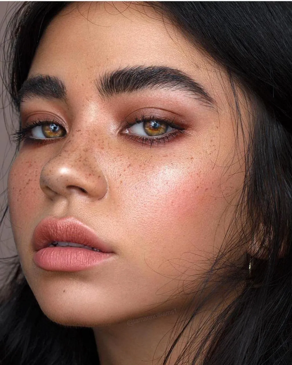 Close Up of a Woman with Bold Brows And Natural Pink Blush