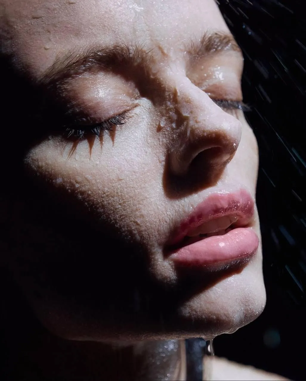 Close Up of a Woman with Eyes Closed Basking in Sunlight