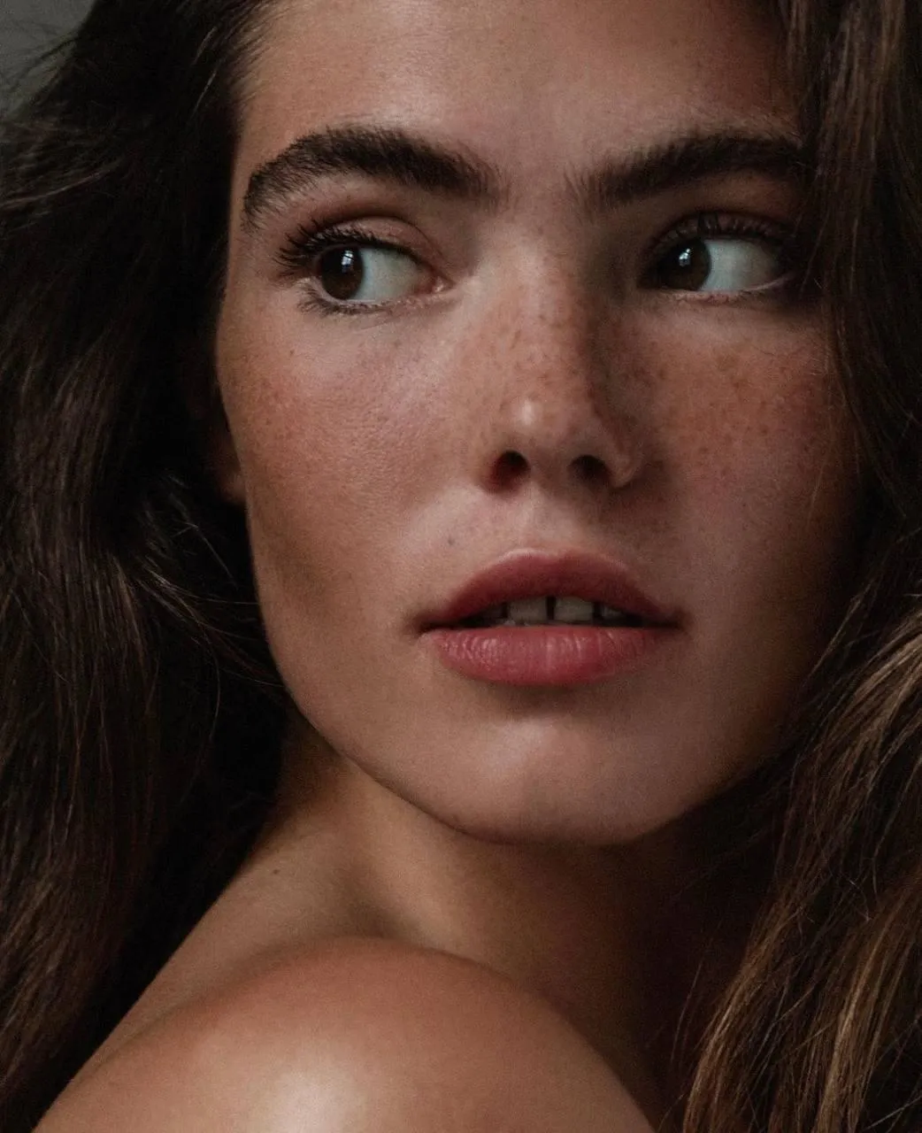 Close Up Portrait Highlighting Freckles And Soft Features