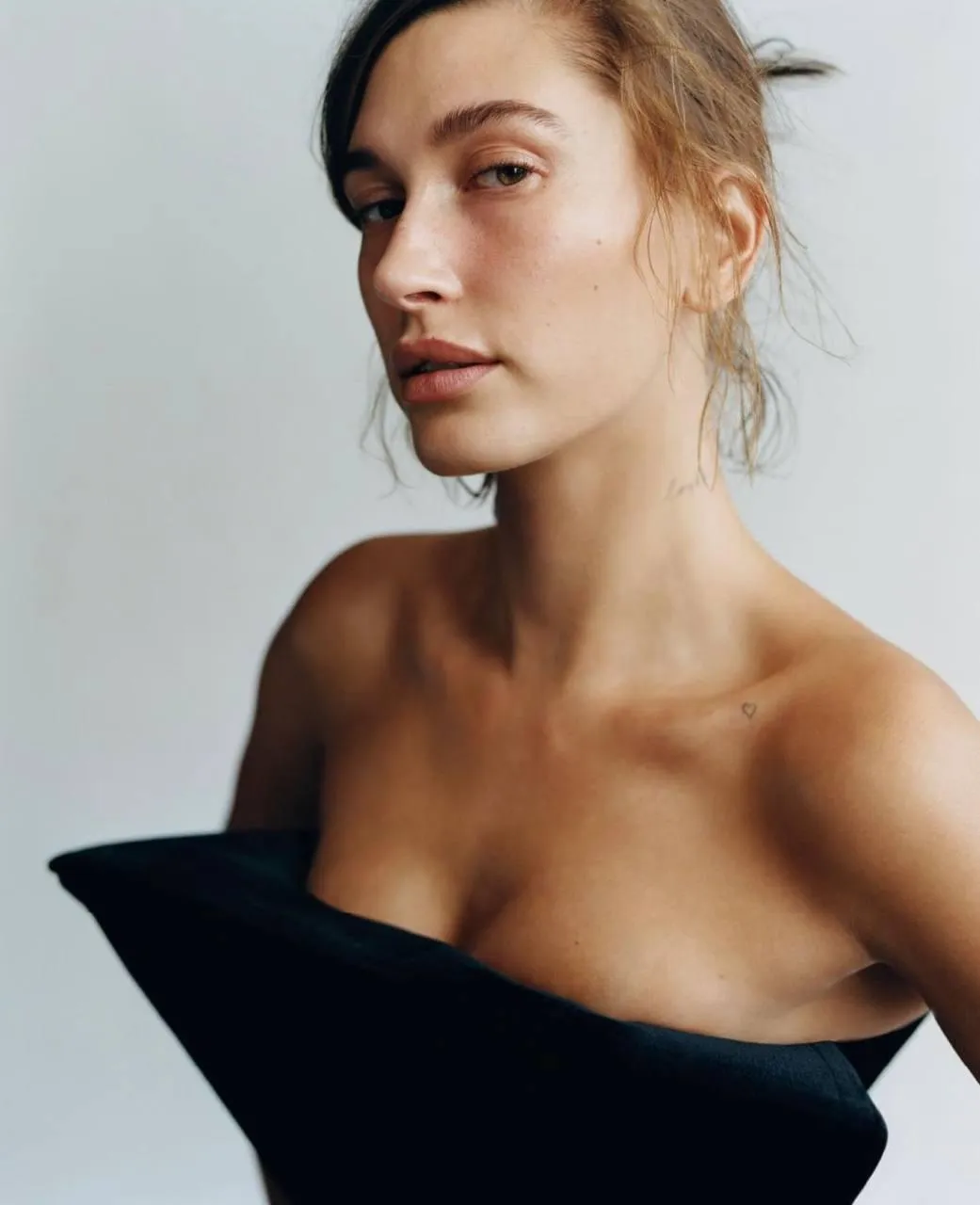 Close up portrait of a confident woman in a black outfit