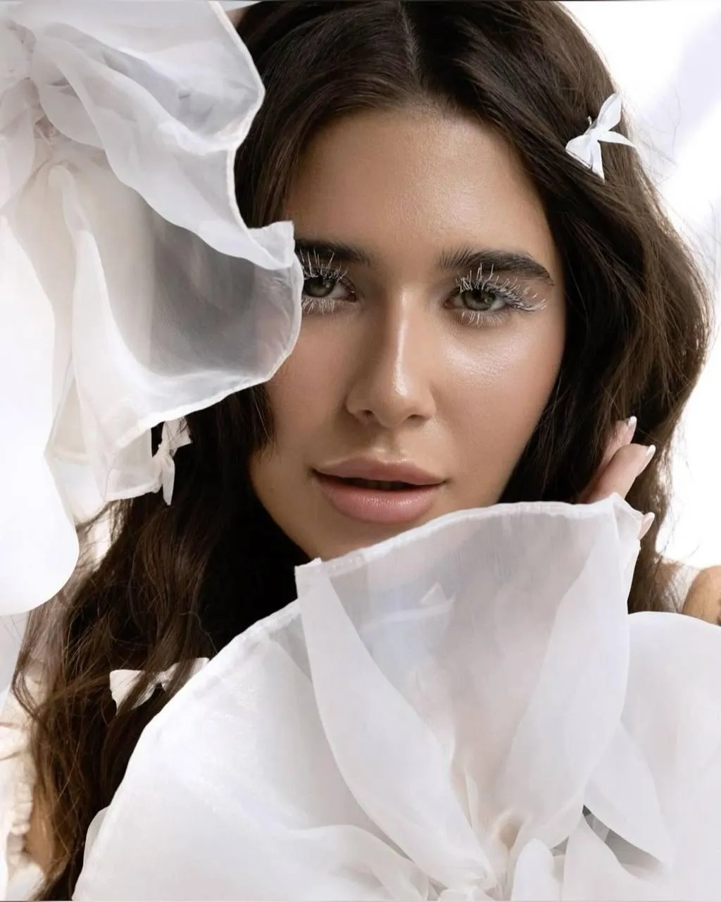 Close Up Portrait of a Woman with Flowing Fabric Around Face