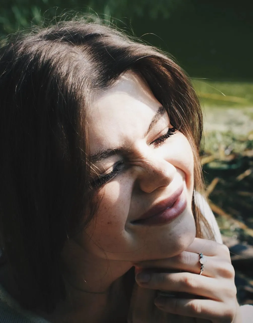 Close Up Smiling Model Bathed in Soft Outdoor Lighting Image