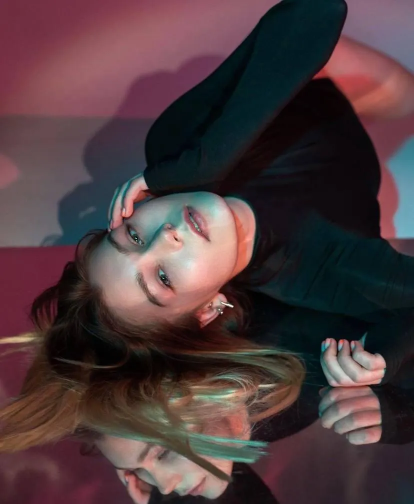 Creative artistic glamour portrait with colorful lights