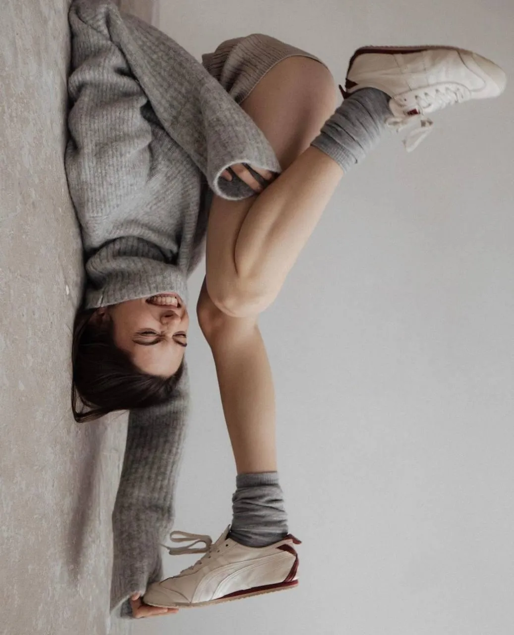 Creative Overhead Shot of a Model Posing with a Curled Body