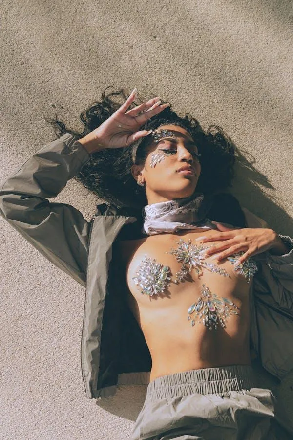 Creative Shot of a Woman Lying on the Sand with Jewelry