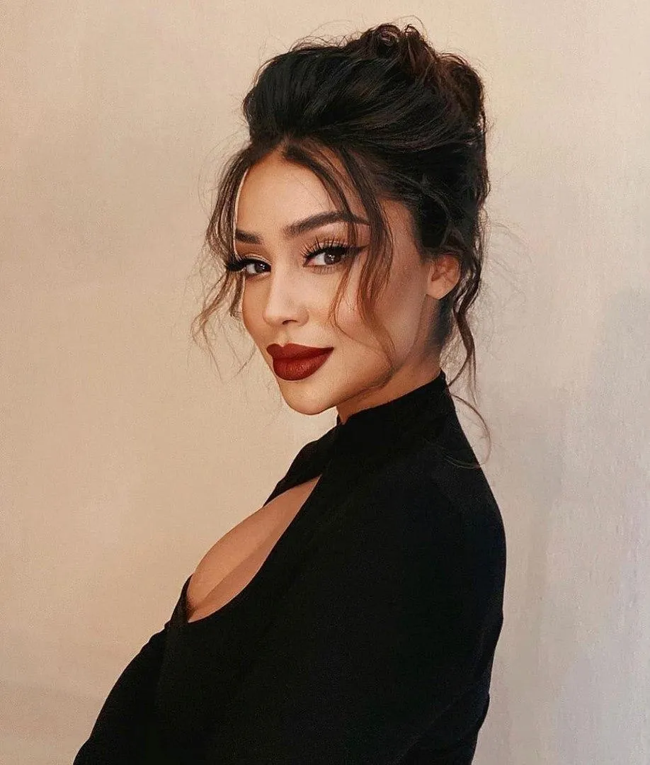 Elegant Studio Portrait of a Woman in a Sleek Black Dress