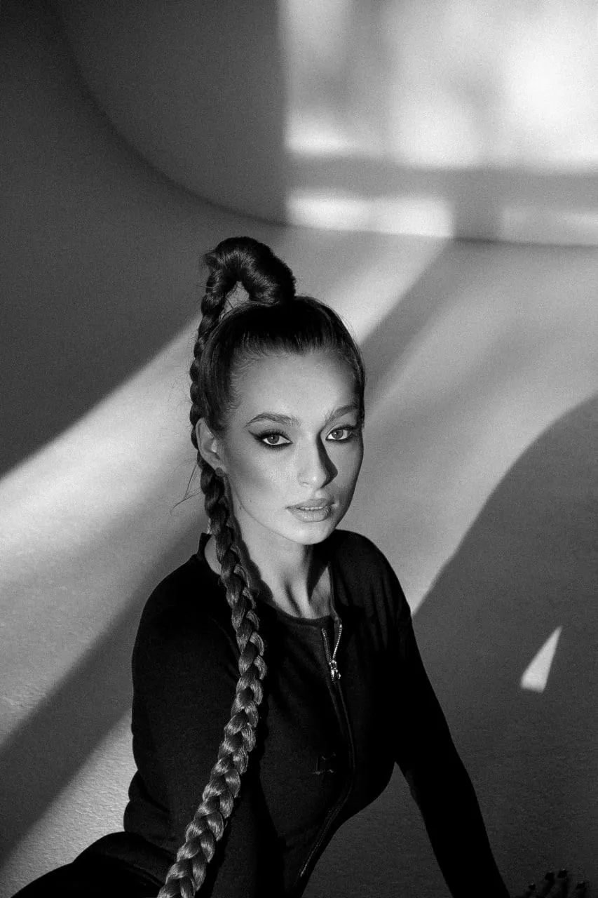 Elegant Woman in a Black And White with a Confident Style