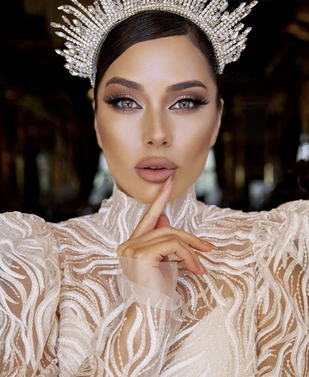 Elegant Woman in a Feathered Dress with a Royal Expression