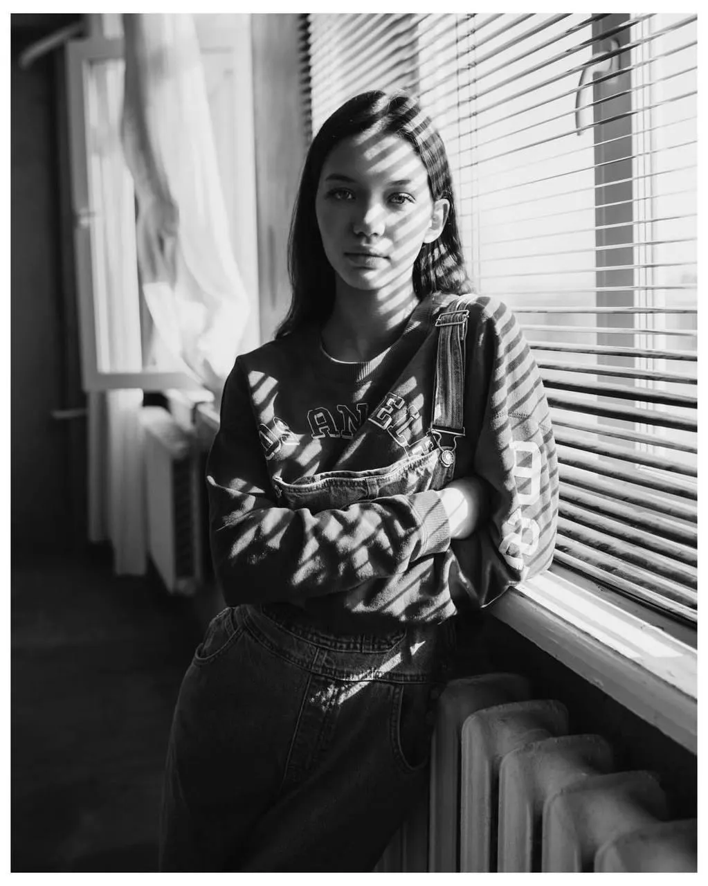 Elegant Woman Near the Window in a Black And White Photo