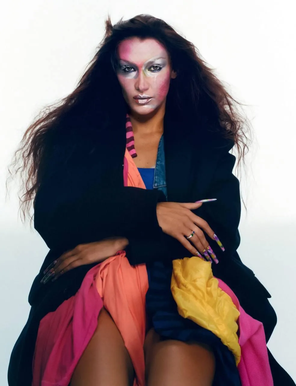 Fashion model sitting with a colorful coat HD free Wallpaper