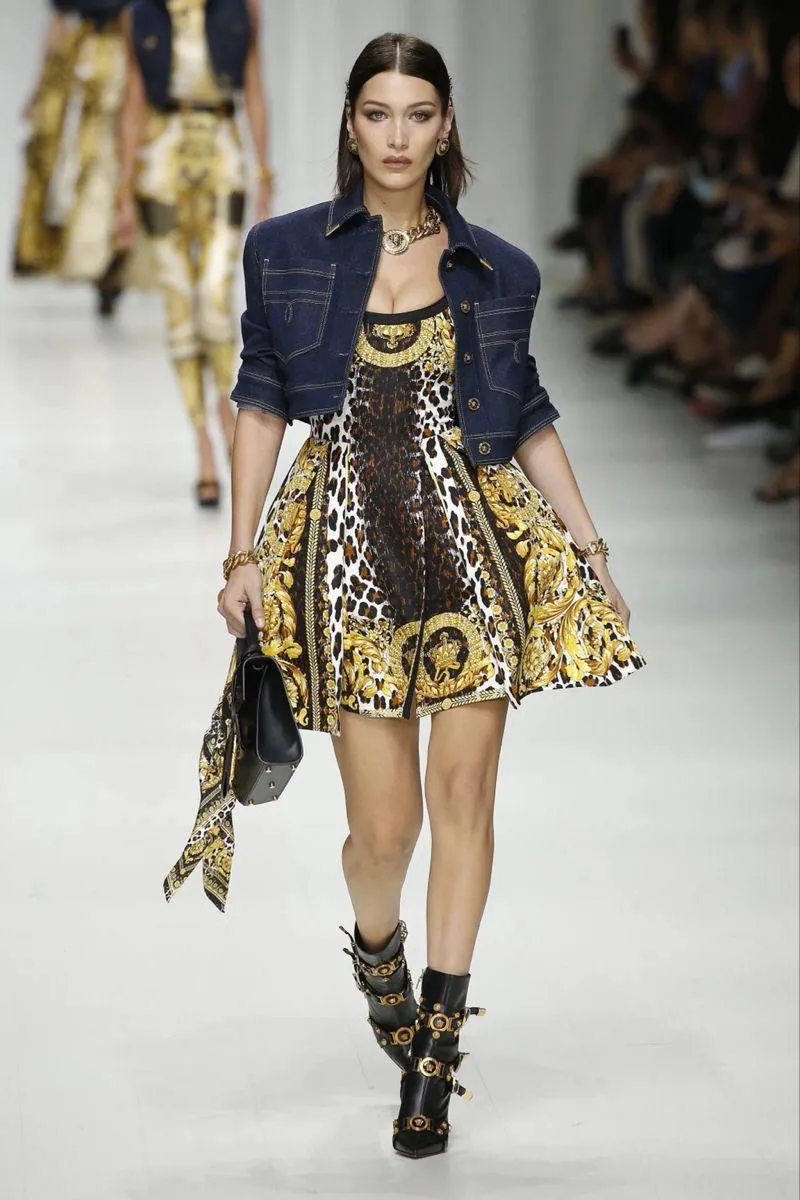 Fashion Model Walking the Runway in a Short Patterned Dress