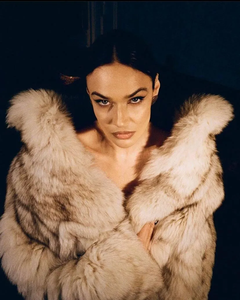 Fierce Woman in a Fur Coat Looking Directly at the Camera