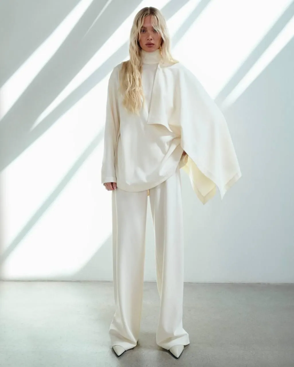 Minimalist fashion look in a modern white oversized outfit