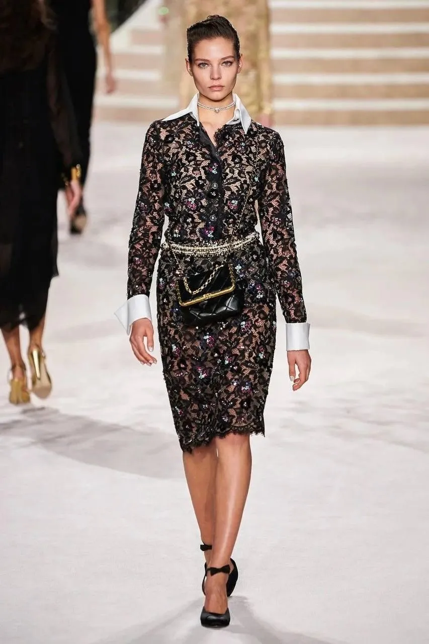 Model Walking Runway in a Black Sequin Dress And Heels