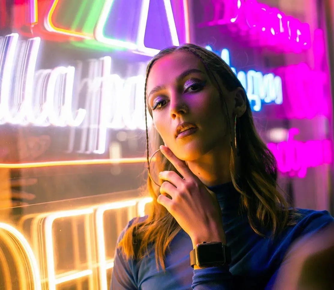 Model with Neon Lights Creating a Colorful Urban Contrast