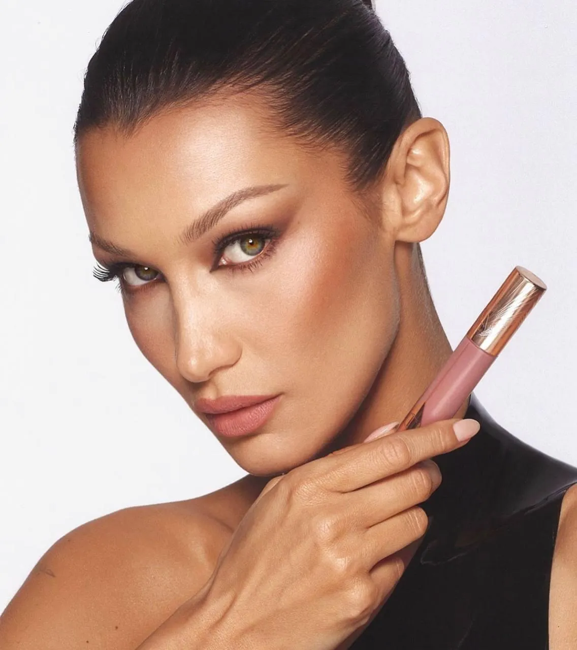 Model with Sleek Hair Posing with Finger on Cheek Wallpaper